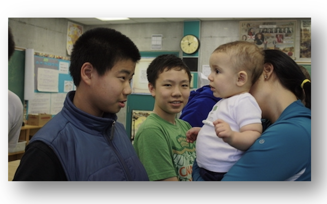 Mom holding up Tiny Teacher